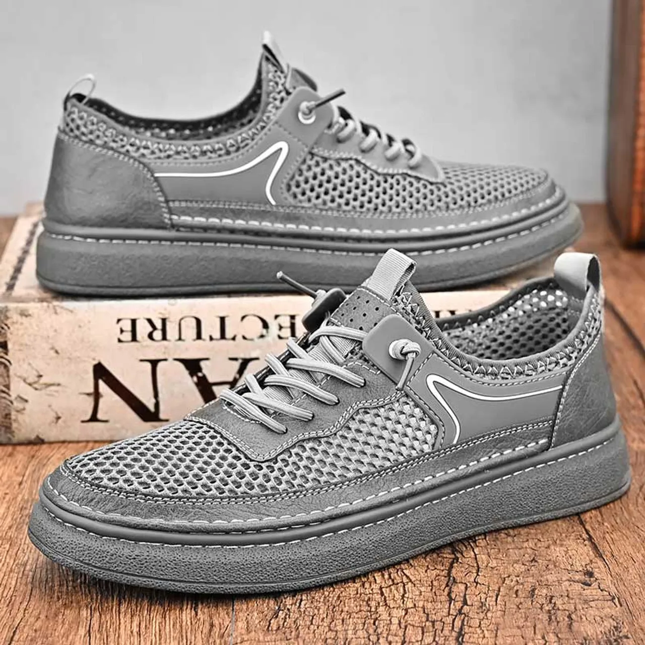 Grey hollow mesh stitch accents shoe sneaker